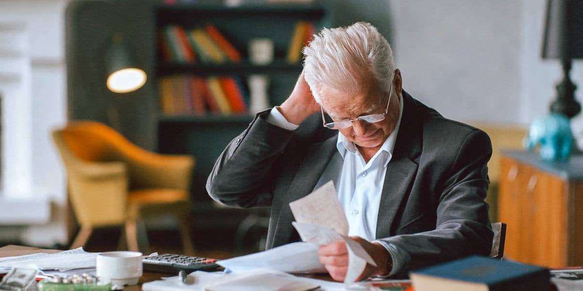 man stressed debt payments